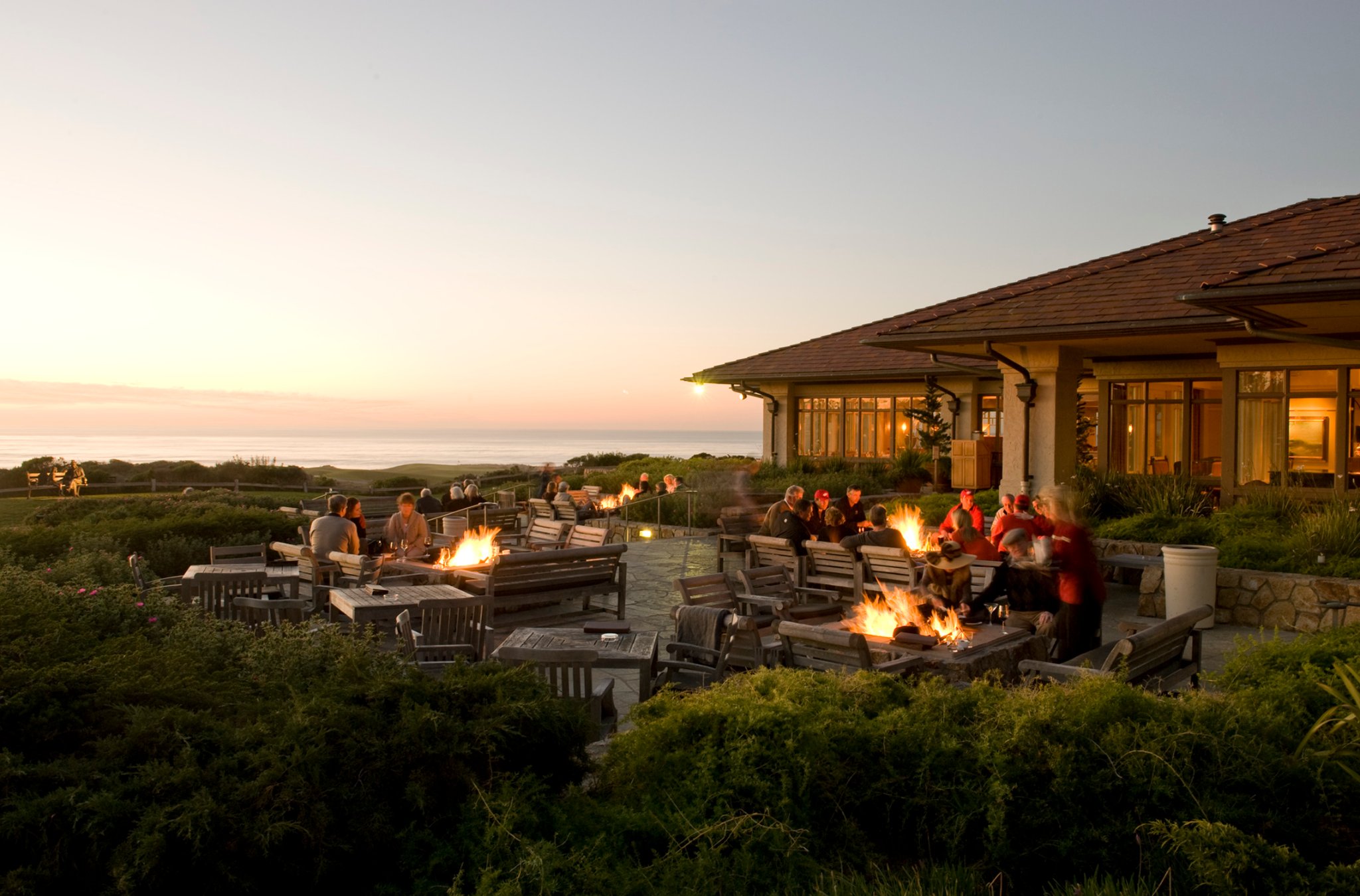 The Inn at Spanish Bay — patio fire pits at dusk